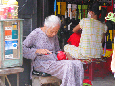 Old Woman Making Lantern